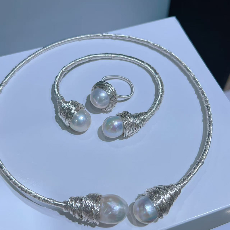 Chic Minimalist Pearl Accessory Pairing Featuring a Soft Choker Neckpiece Alongside a Coordinating Wrist Ornament
