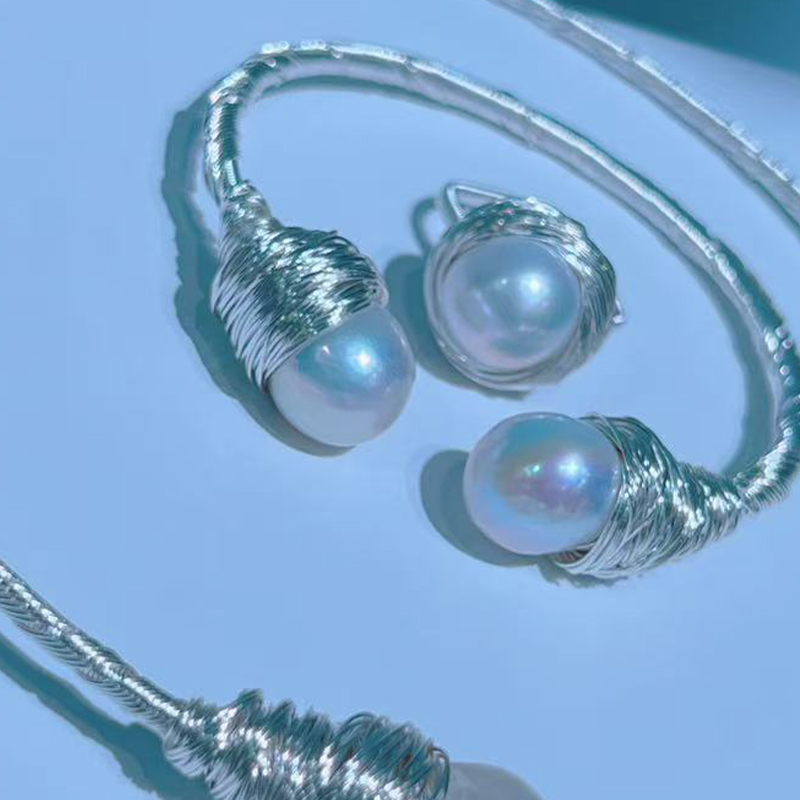 Chic Minimalist Pearl Accessory Pairing Featuring a Soft Choker Neckpiece Alongside a Coordinating Wrist Ornament