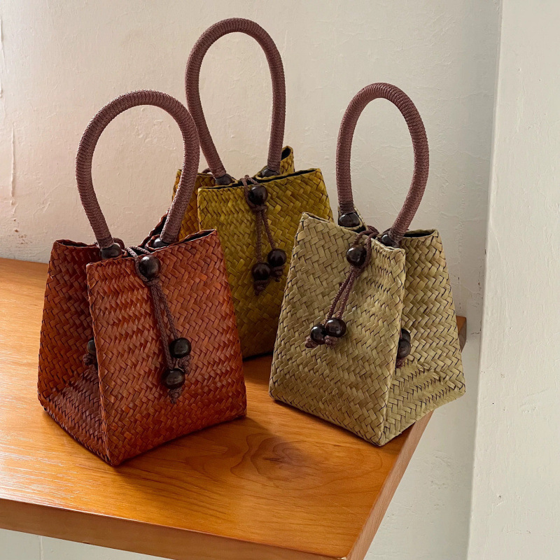 Free Shipping Designer Bag Thailand Imported Vintage Straw Woven Small Tote Bag With Wooden Buckle Solid Color Woven Bag Bucket Bag For Women