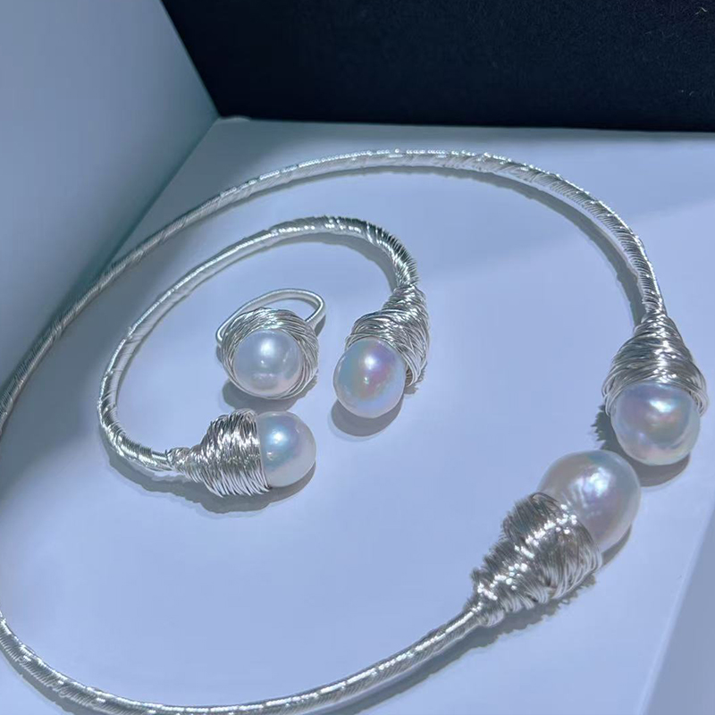 Chic Minimalist Pearl Accessory Pairing Featuring a Soft Choker Neckpiece Alongside a Coordinating Wrist Ornament