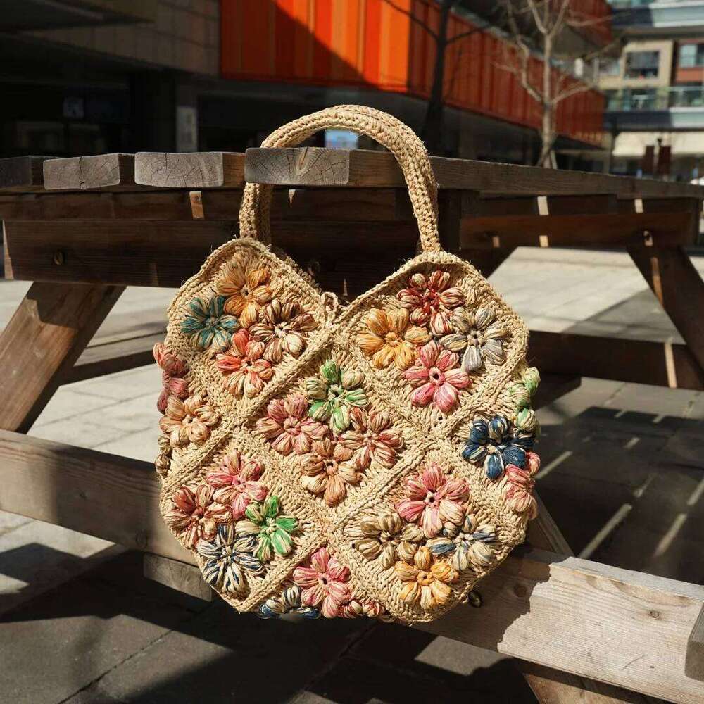 Designer Bag New French Handmade Lafite Grass Hollowed Out Woven Flower Petal Pattern Portable Women S Seaside Vacation Fashion Bag Trend