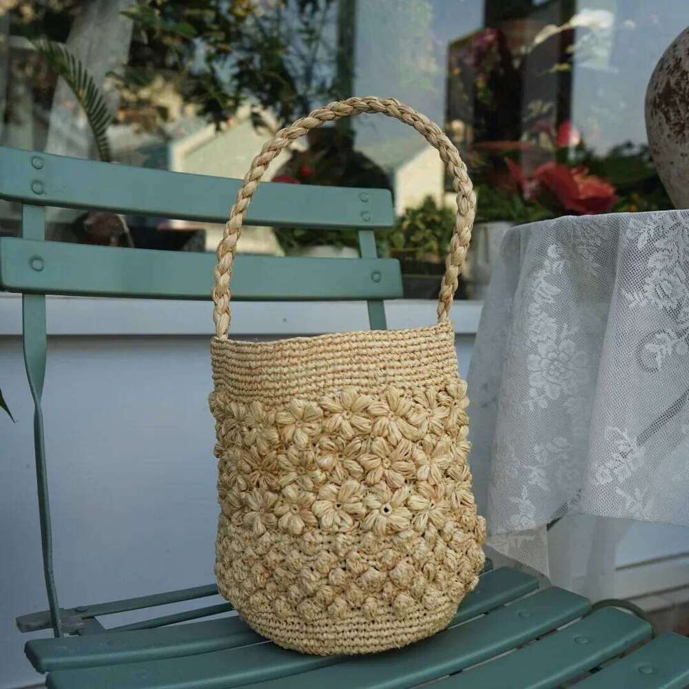 Designer Bag New French Handmade Lafite Grass Hollowed Out Woven Flower Petal Pattern Portable Women S Seaside Vacation Fashion Bag Trend