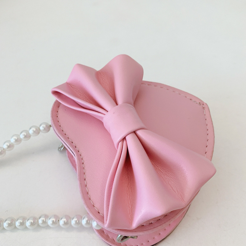 New heart shaped bow children s bag fashionable and sweet girl pearl accessories crossbody fashion bag designer women s fashion shoulder bag
