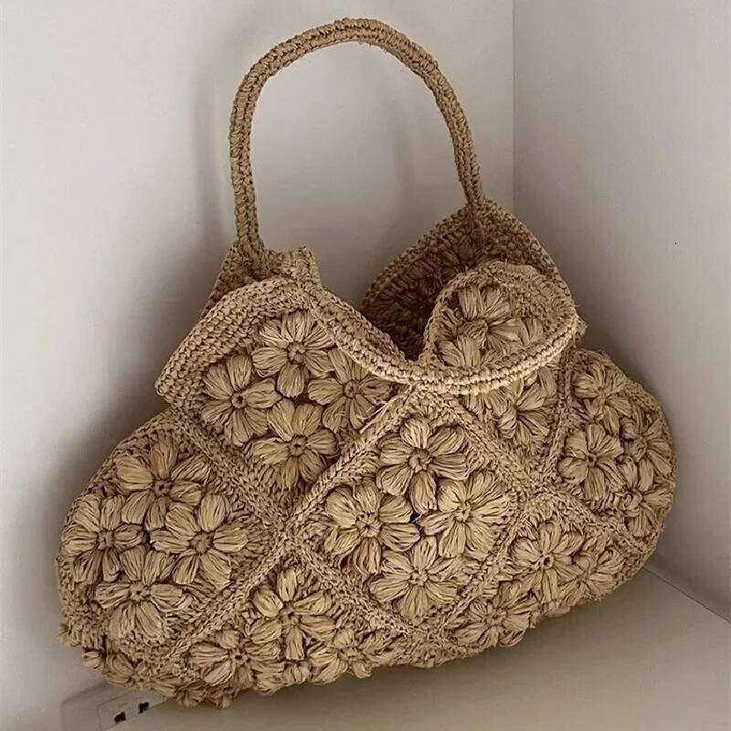 Designer Bag New French Handmade Lafite Grass Hollowed Out Woven Flower Petal Pattern Portable Women S Seaside Vacation Fashion Bag Trend