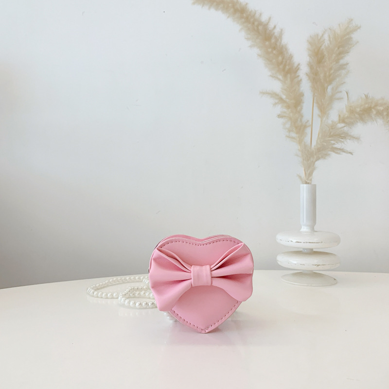 New heart shaped bow children s bag fashionable and sweet girl pearl accessories crossbody fashion bag designer women s fashion shoulder bag