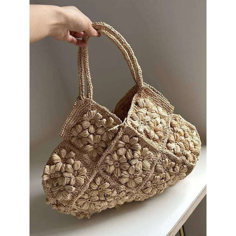 Designer Bag New French Handmade Lafite Grass Hollowed Out Woven Flower Petal Pattern Portable Women S Seaside Vacation Fashion Bag Trend