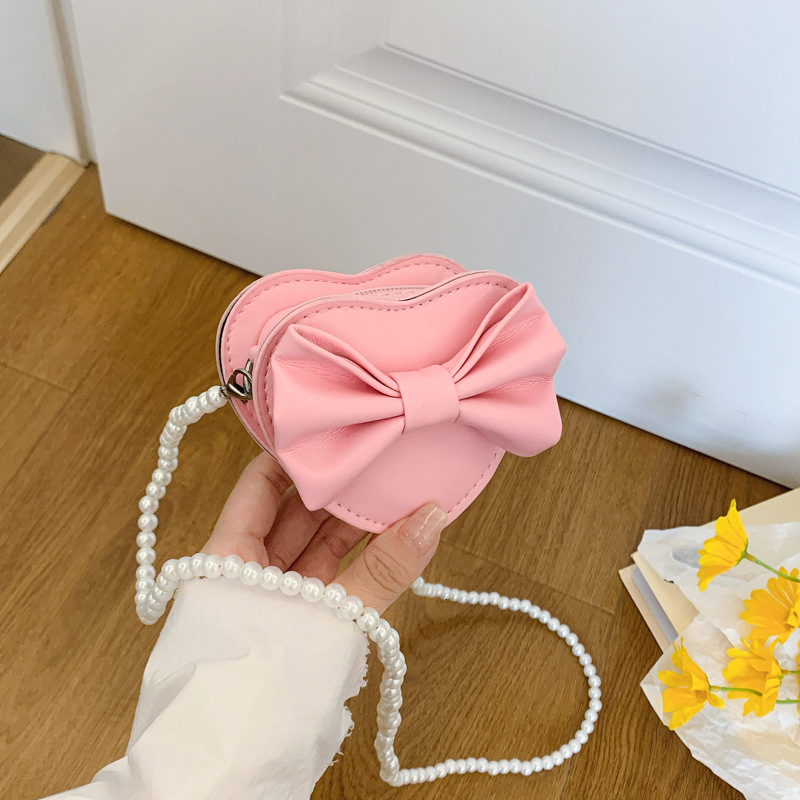 New heart shaped bow children s bag fashionable and sweet girl pearl accessories crossbody fashion bag designer women s fashion shoulder bag