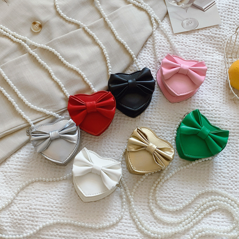 New heart shaped bow children s bag fashionable and sweet girl pearl accessories crossbody fashion bag designer women s fashion shoulder bag