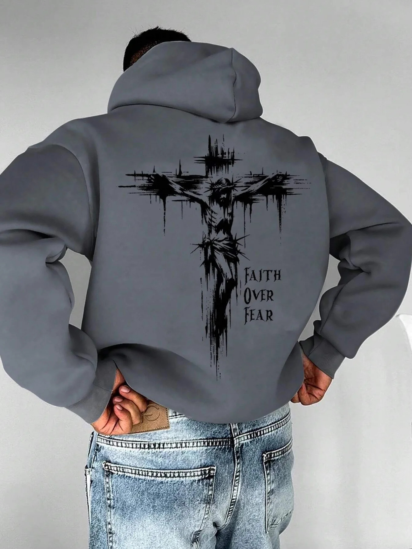 A mens hoodie with the words Christian faith Overcomes fear printed on it features a cross-shaped on the back251129 - view 4