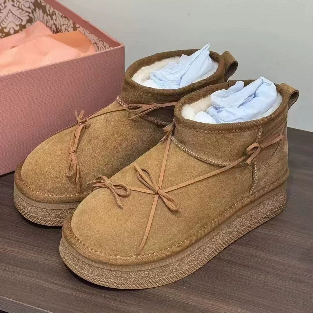 Winter designer's new thick soled butterfly knot snow boots for women with plush insulation and anti slip short boots free shipping size 35-40