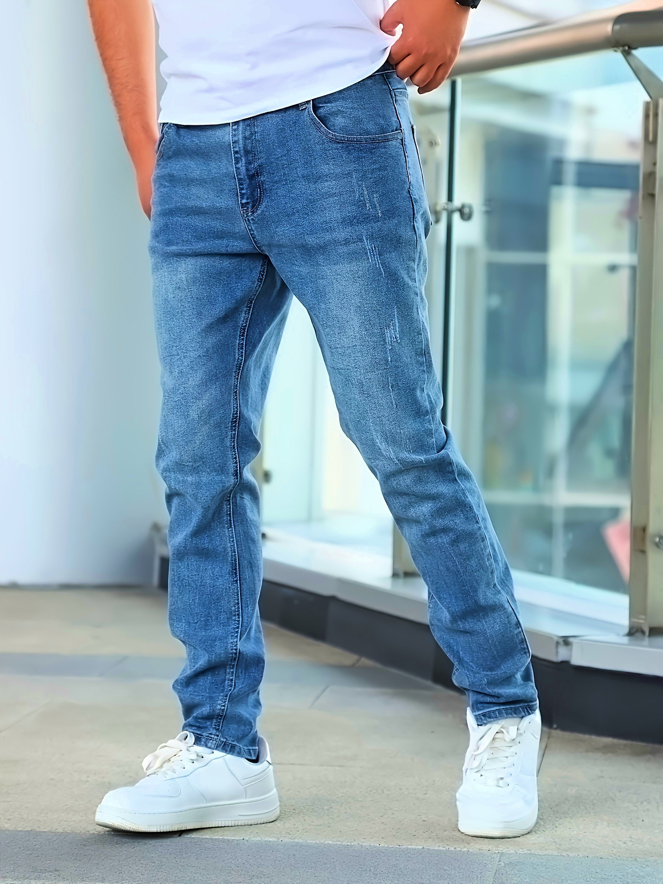 European and American cross-border men's fashion jeans are suitable for wearing all year round elastic simple multi-process and form-fitting blue