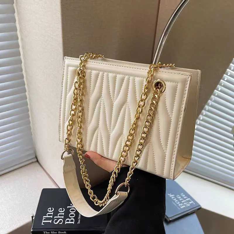 New stylish womens bag with trendy chain shoulder and crossbody design featuring unique embroidery versatile for commutingT251205