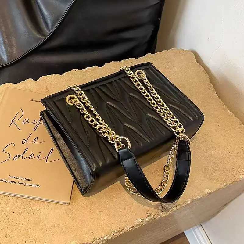 New stylish womens bag with trendy chain shoulder and crossbody design featuring unique embroidery versatile for commutingT251205