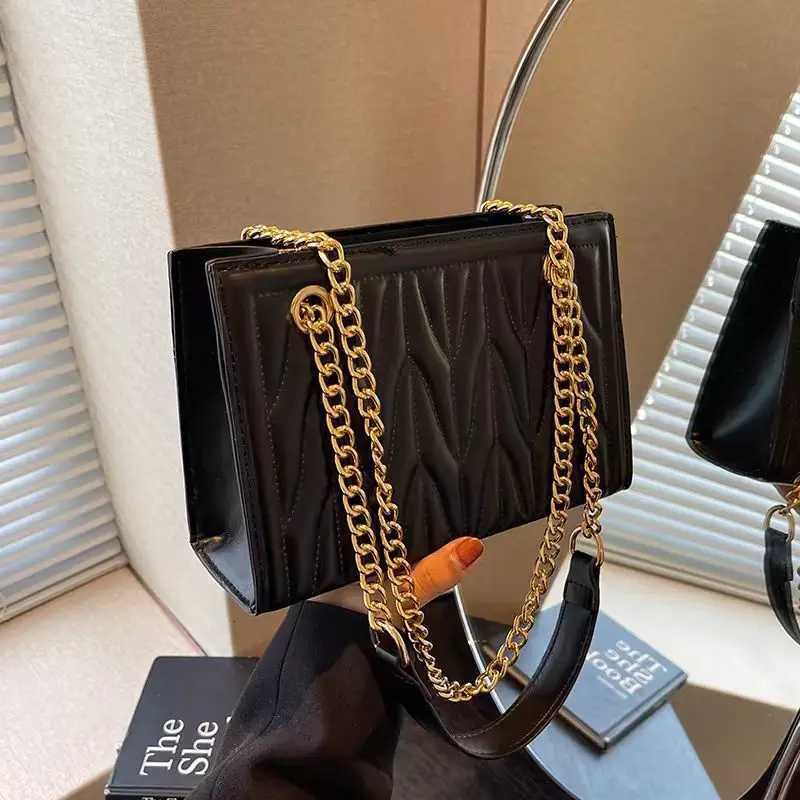 New stylish womens bag with trendy chain shoulder and crossbody design featuring unique embroidery versatile for commutingT251205