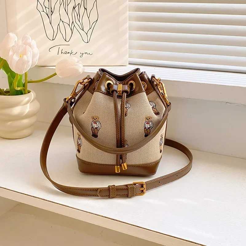 2025 New Retro Womens Bucket Bag - Collision-Color Bear Embroidery Small Bag Durable Canvas Simple Casual TrendyT251206