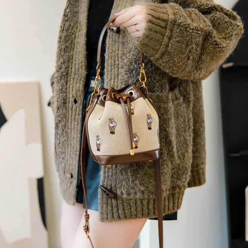 2025 New Retro Womens Bucket Bag - Collision-Color Bear Embroidery Small Bag Durable Canvas Simple Casual TrendyT251206
