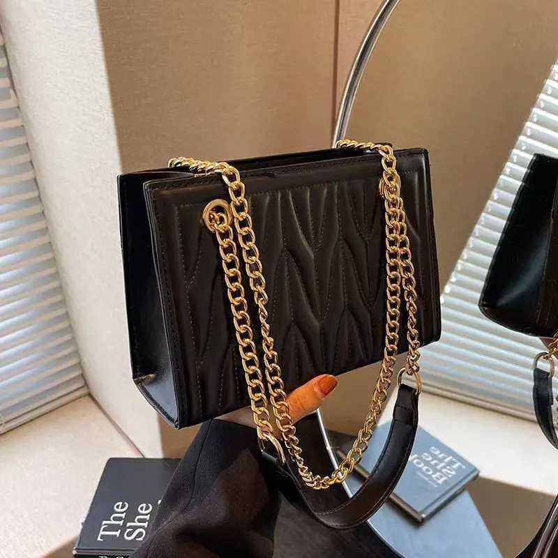 New stylish womens bag with trendy chain shoulder and crossbody design featuring unique embroidery versatile for commutingT251205