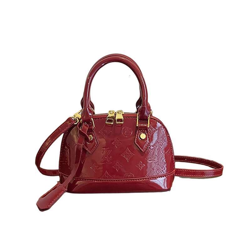 2025 Designer Bag Semicircle Bag New Fashion Versatile Glossy Letter Embossed Print Bag High Quality Women Shoulder Crossbody Bag Makeup Bag Coin Purs