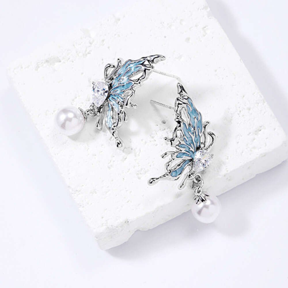 DHcollections Niche Design Ice Blue Butterfly Pearl Stud Wholesale Fresh Sweet 925 Silver Needle Zircon Earrings