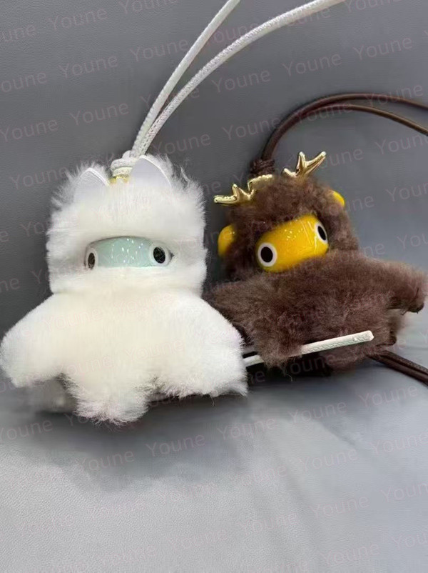 Puzz Fawnie Key Snow Bunny charm in shearling brass Keychains Lanyards Handmade Unique looped calfskin strap and Anagram dice Designe Accessory Bag Ornament