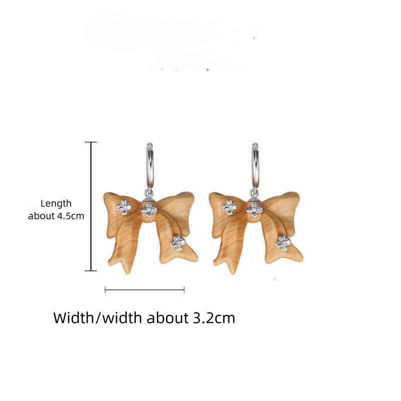 DHcollections Autumn Winter Melad Wooden Bow Earrings for Women, Light Luxury Niche Original Design, Elegant Versatile Clips and Ear Jewelry