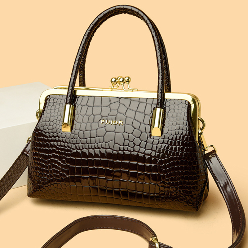 Manufacturer's spot wholesale women's handbags, fashionable diagonal cross clip mouth bags, European and American Spanish women's bags,