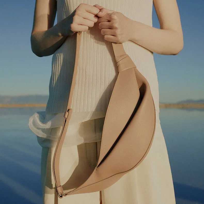 2025 light luxury new smooth cowhide womens shoulder crossbody bag fashionable and versatile cow horn bagT251213