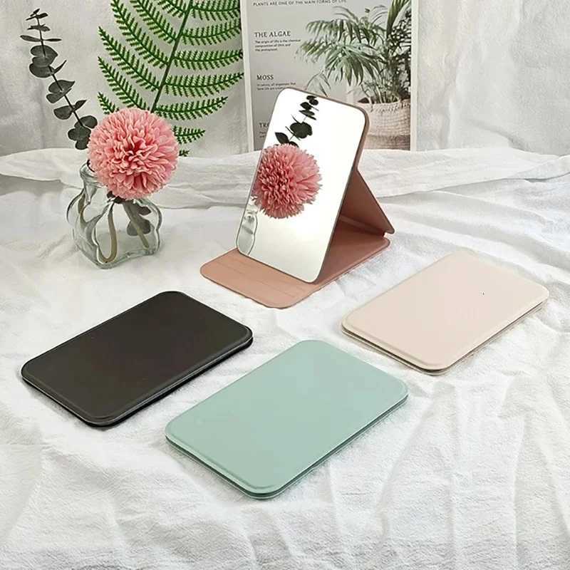 Woman MINI Folding Makeup Mirror High-quality Portable Pocket Makeup Mirror Single-side Creative Women Solid Color Handle DeskT251213