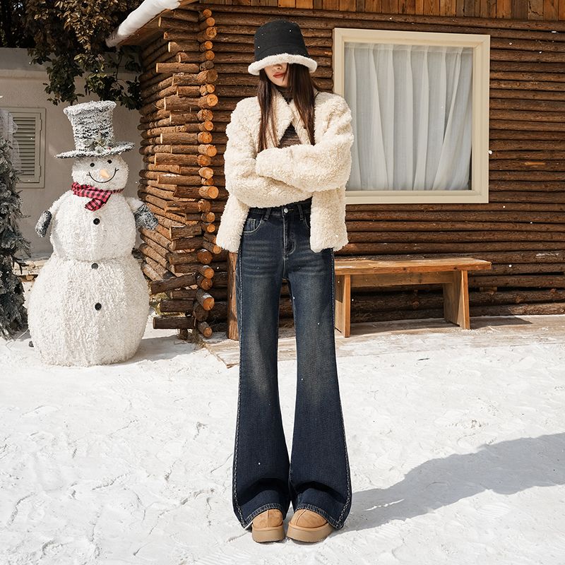 Fleece, warm, elastic, embroidered, slightly flared jeans for women are loose and do not stick to the legs. Retro flared pants are slimming and versat