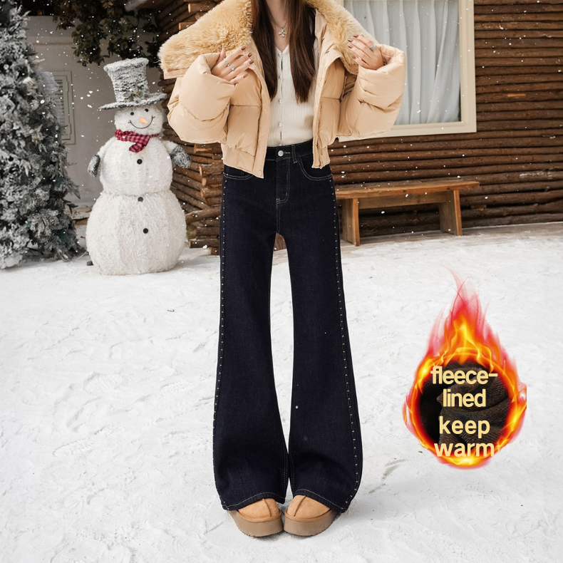 Fleece, warm, elastic, embroidered, slightly flared jeans for women are loose and do not stick to the legs. Retro flared pants are slimming and versat