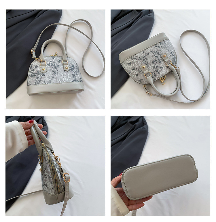 Crossbody casual commuting handheld shell bag womens 2026 spring new style simple and fashionable single shoulder