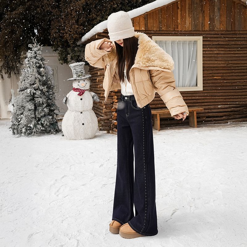 Fleece, warm, elastic, embroidered, slightly flared jeans for women are loose and do not stick to the legs. Retro flared pants are slimming and versat