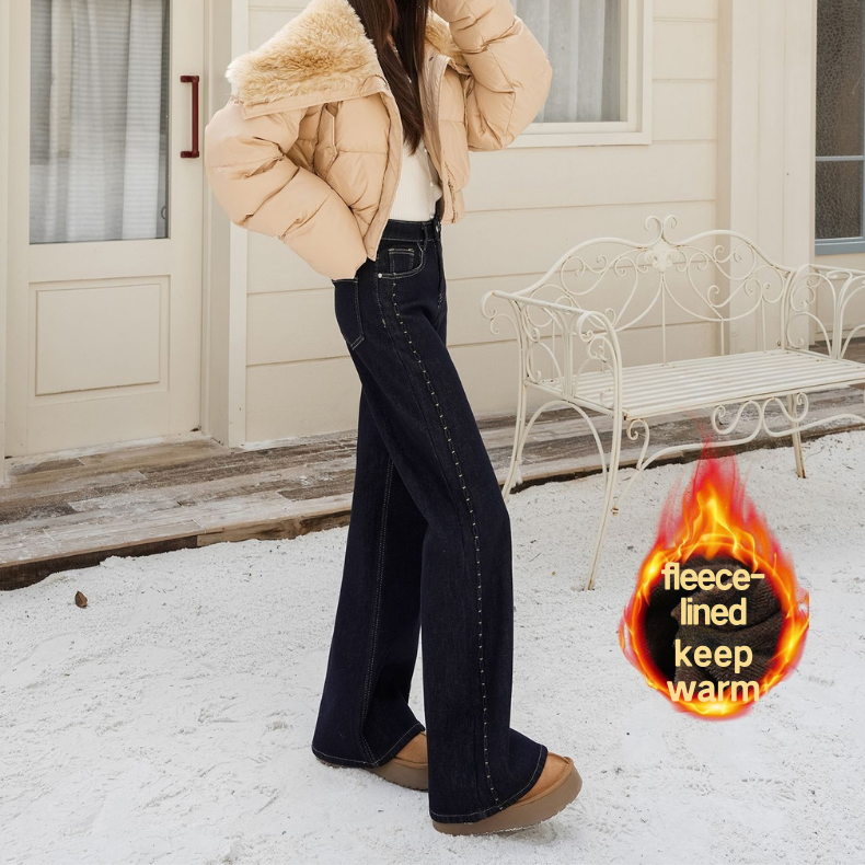 Fleece, warm, elastic, embroidered, slightly flared jeans for women are loose and do not stick to the legs. Retro flared pants are slimming and versat