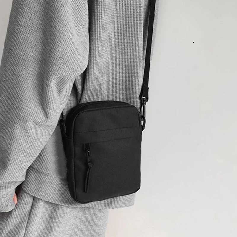 Neutral style shoulder bag for men and women small square bag suitable for travel and photography pure black bagT251215