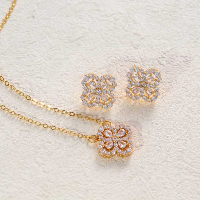 A set of high-quality flower-shaped decorative earrings and a necklace made of copper and set with zirconium stones G251217
