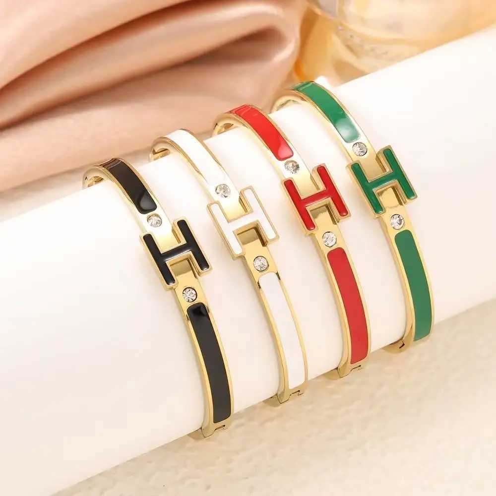 European and American womens high-end oil dripping letter H gold titanium steel enamel M251220