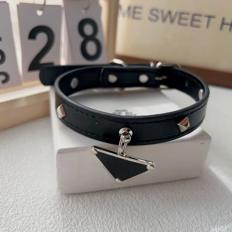 Cute luxury leather pet collar and leash set with classic triangular metal charm, suitable for dogs and cats.