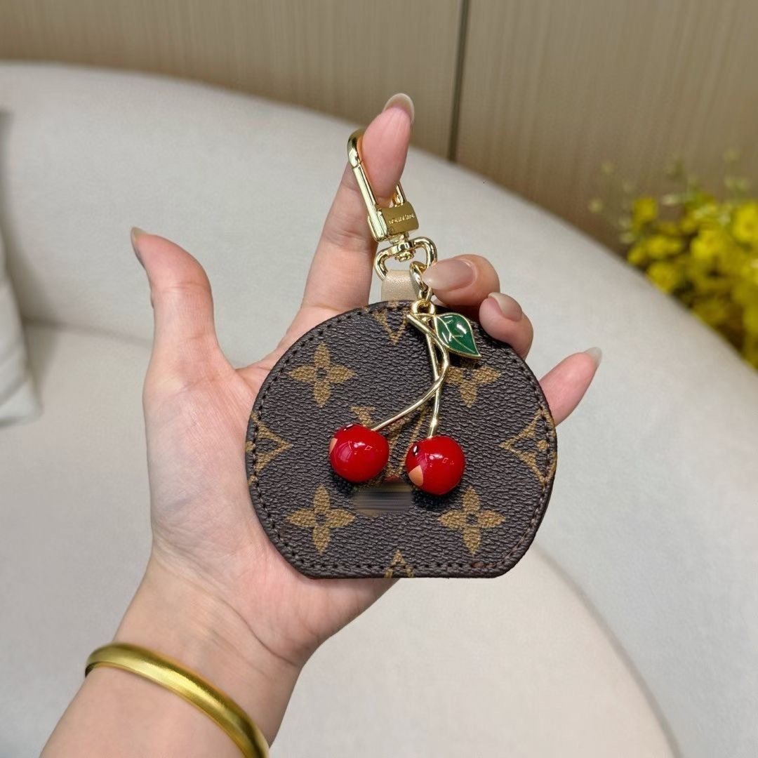 Designer keychain French light luxury fruit cherry bag pendant European and American style niche design high-end women's pendant portable makeup mirror