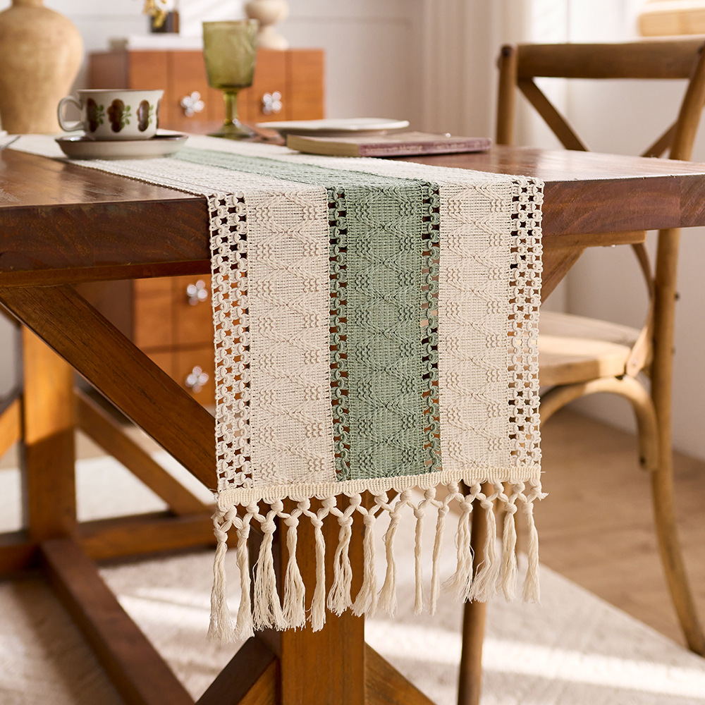 Sage green cotton table runner with tassels and openwork design, perfect for kitchen or dining table decoration. EQ2M01