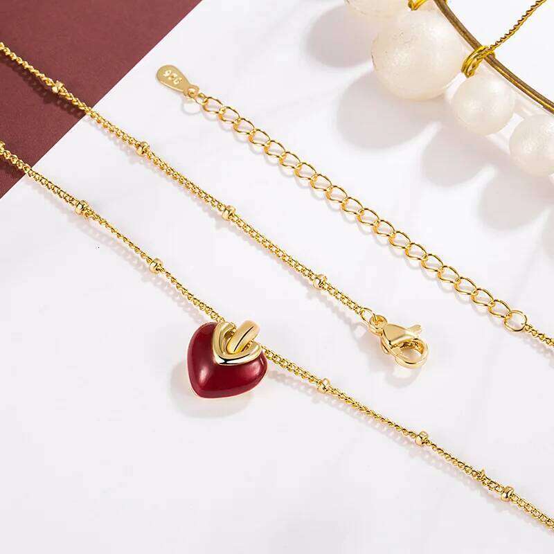 The 925 sterling silver retro red oil-dripping heart pendant is a new trendy collarbone chain necklace and wedding jewe 25N1226