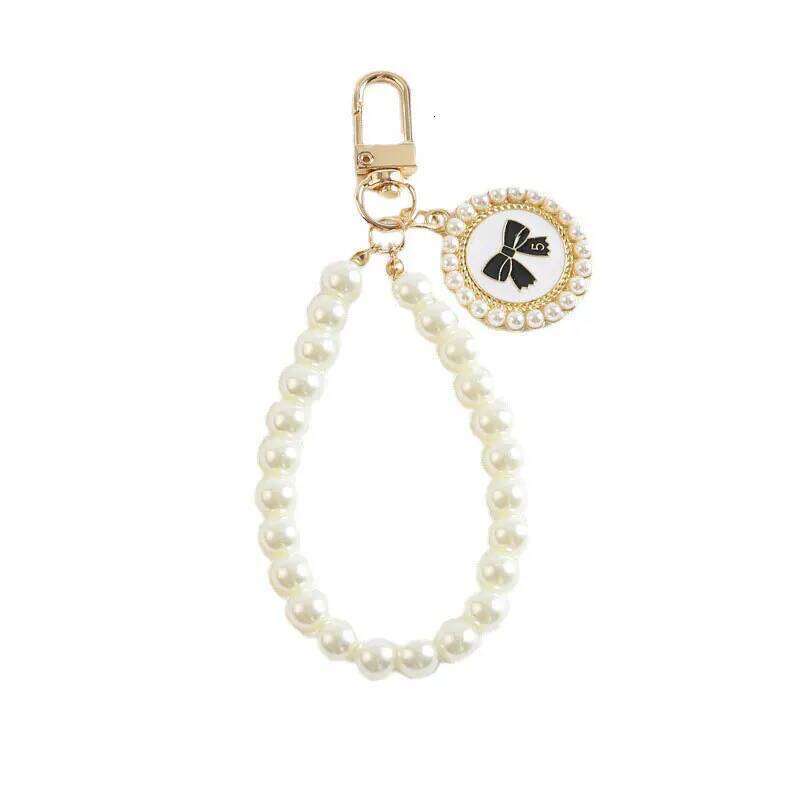 ZAKOL Cute Bow Keychain for Women Girls Shiny Pearl Beads Mobile Phone Bag Backpack Pendant Accessories Car Key Chain