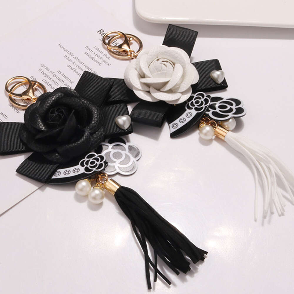 Women's Keychain Ornament Hanging Chain metal Hot Sale New Accessories Pearl Bow Pendant Jewelry Earphone Case Leather Flower Car Key Ring Phone 