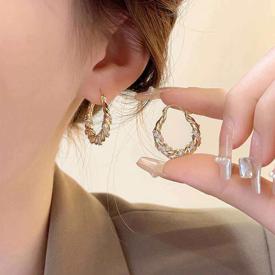 ZAKOL New Unique Shiny Zircon Winding Hoop Earrings for Women Fashion OL Style Gold Color Ear Accessories Party Jewelry