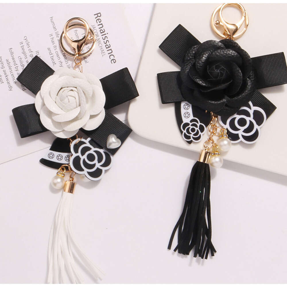 Women's Keychain Ornament Hanging Chain metal Hot Sale New Accessories Pearl Bow Pendant Jewelry Earphone Case Leather Flower Car Key Ring Phone 