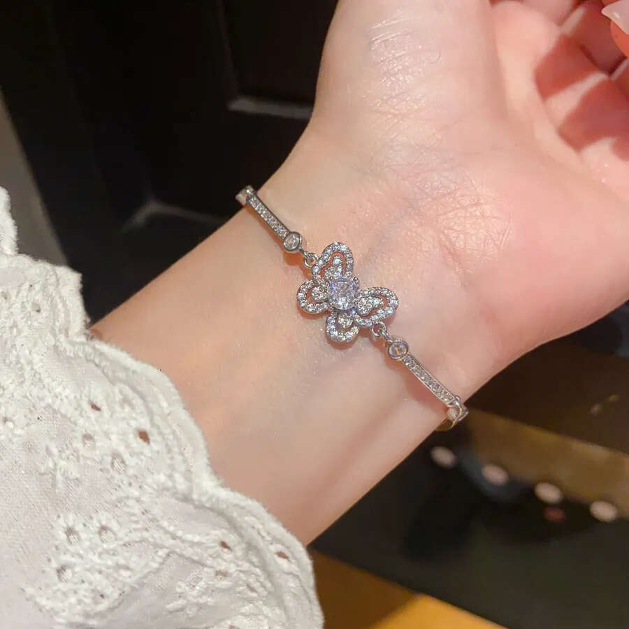 Designer Jewellery Silver Tone Butterfly Bracelet with Pave CZ Sparkle and Crystal Encrusted Chain for Daily and Special Occasion Gift Textured Elegan