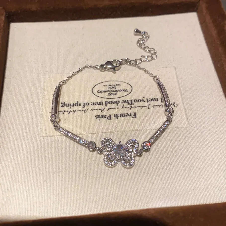 Designer Jewellery Silver Tone Butterfly Bracelet with Pave CZ Sparkle and Crystal Encrusted Chain for Daily and Special Occasion Gift Textured Elegan