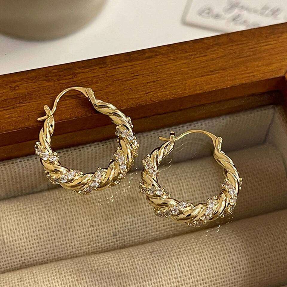 ZAKOL New Unique Shiny Zircon Winding Hoop Earrings for Women Fashion OL Style Gold Color Ear Accessories Party Jewelry