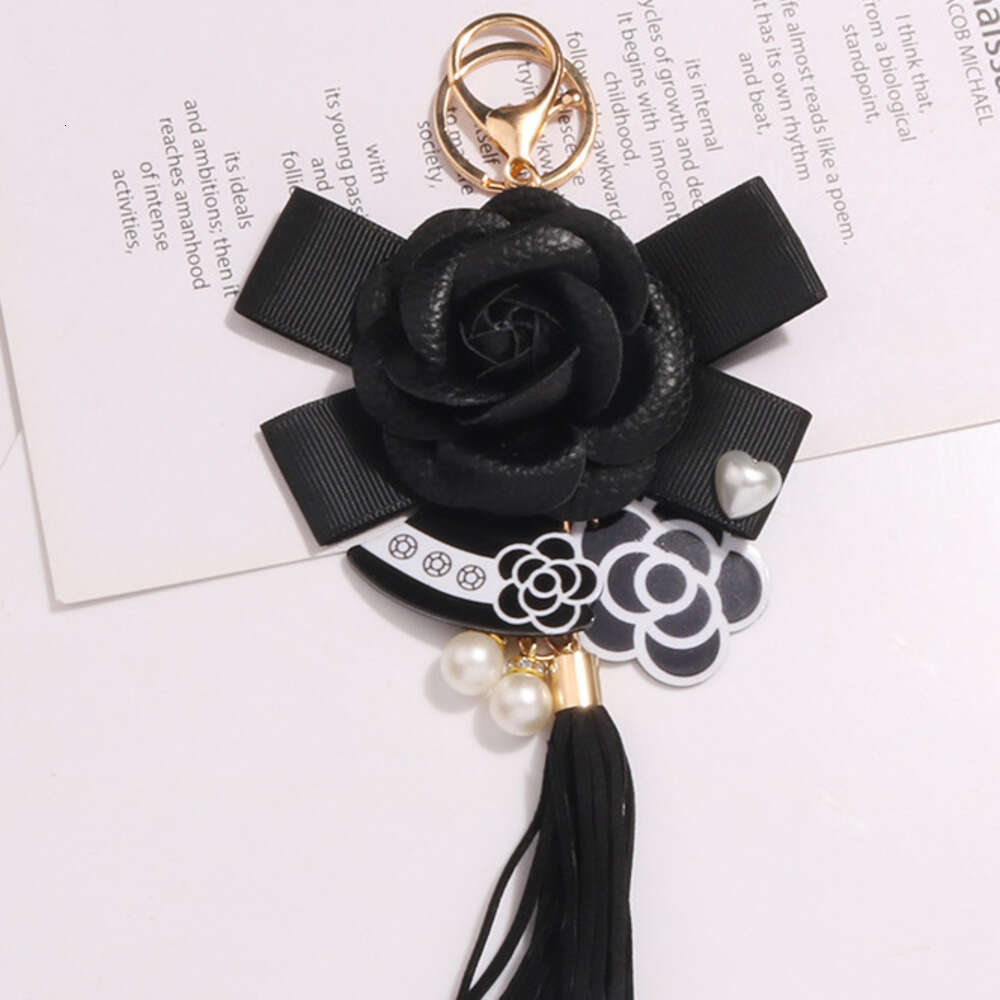 Women's Keychain Ornament Hanging Chain metal Hot Sale New Accessories Pearl Bow Pendant Jewelry Earphone Case Leather Flower Car Key Ring Phone 