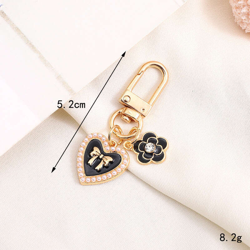 Pearl Bow Pendant Headphone Case Keychain Keychain Designer Accessory Chain Jewelry Accessories