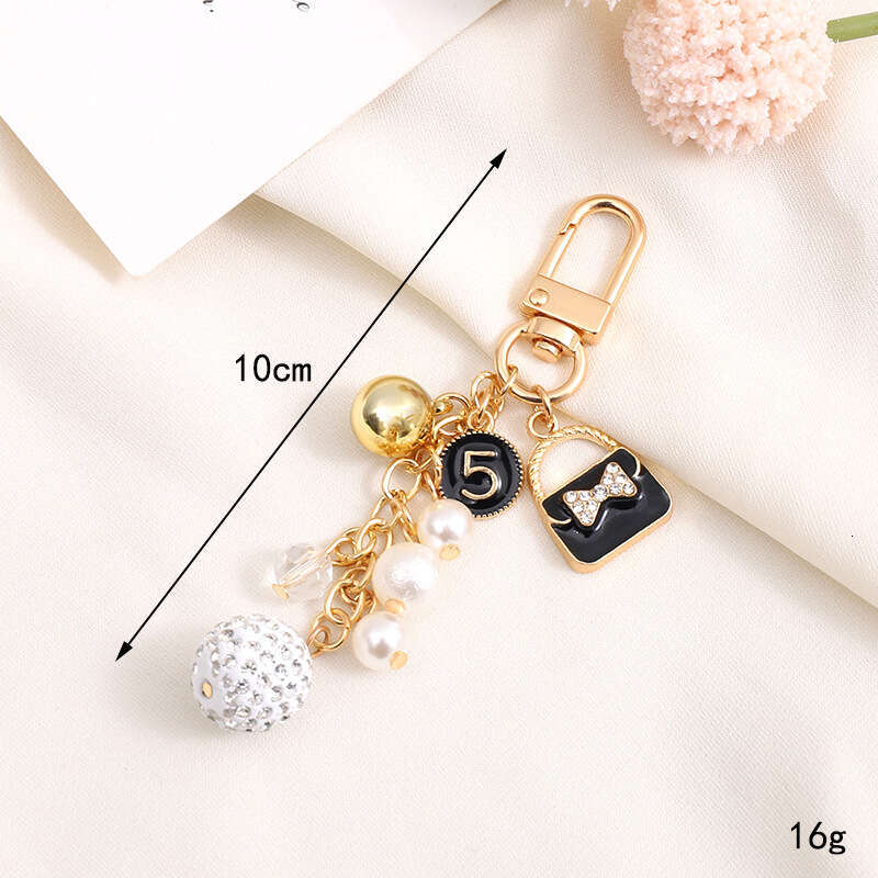 Pearl Bow Pendant Headphone Case Keychain Keychain Designer Accessory Chain Jewelry Accessories